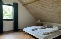 Horním patře je manželská dvoupostel